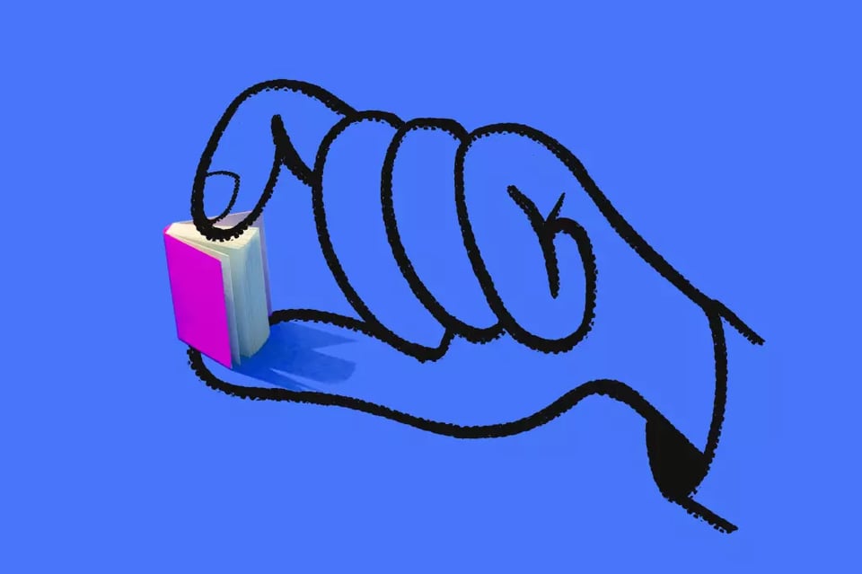 a hand "dosing" a small book