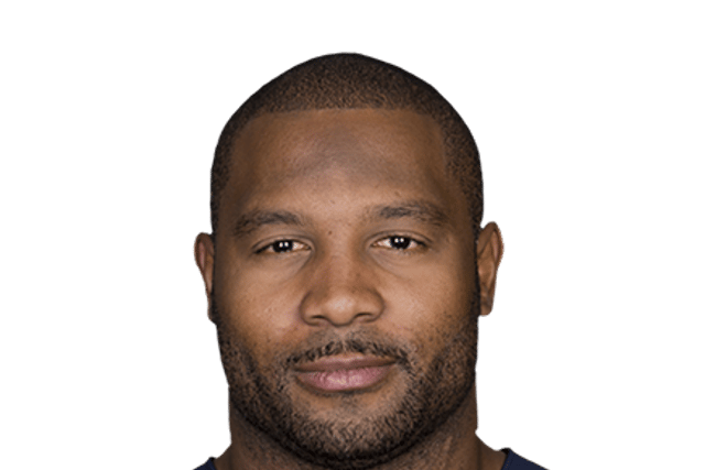 A burly former football player in his jersey.
